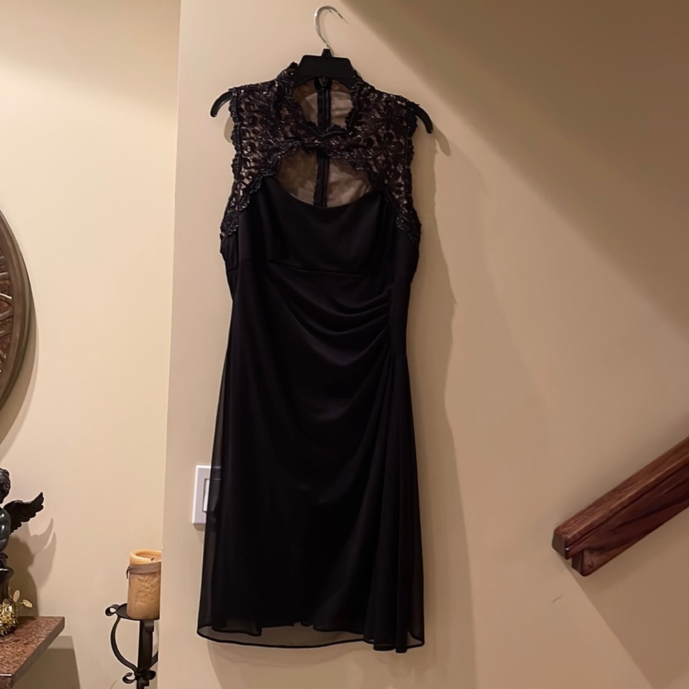 Black dress with lace around the neck and back